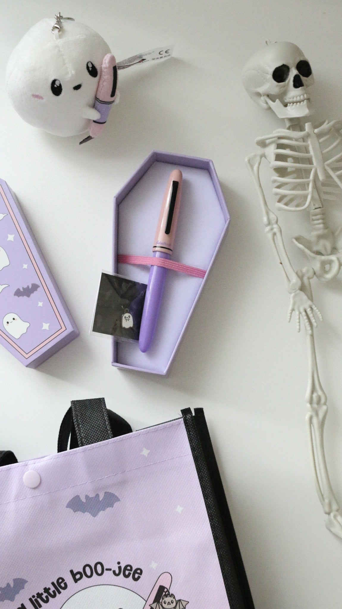 Pastel Halloween Estie in its coffin shaped box
