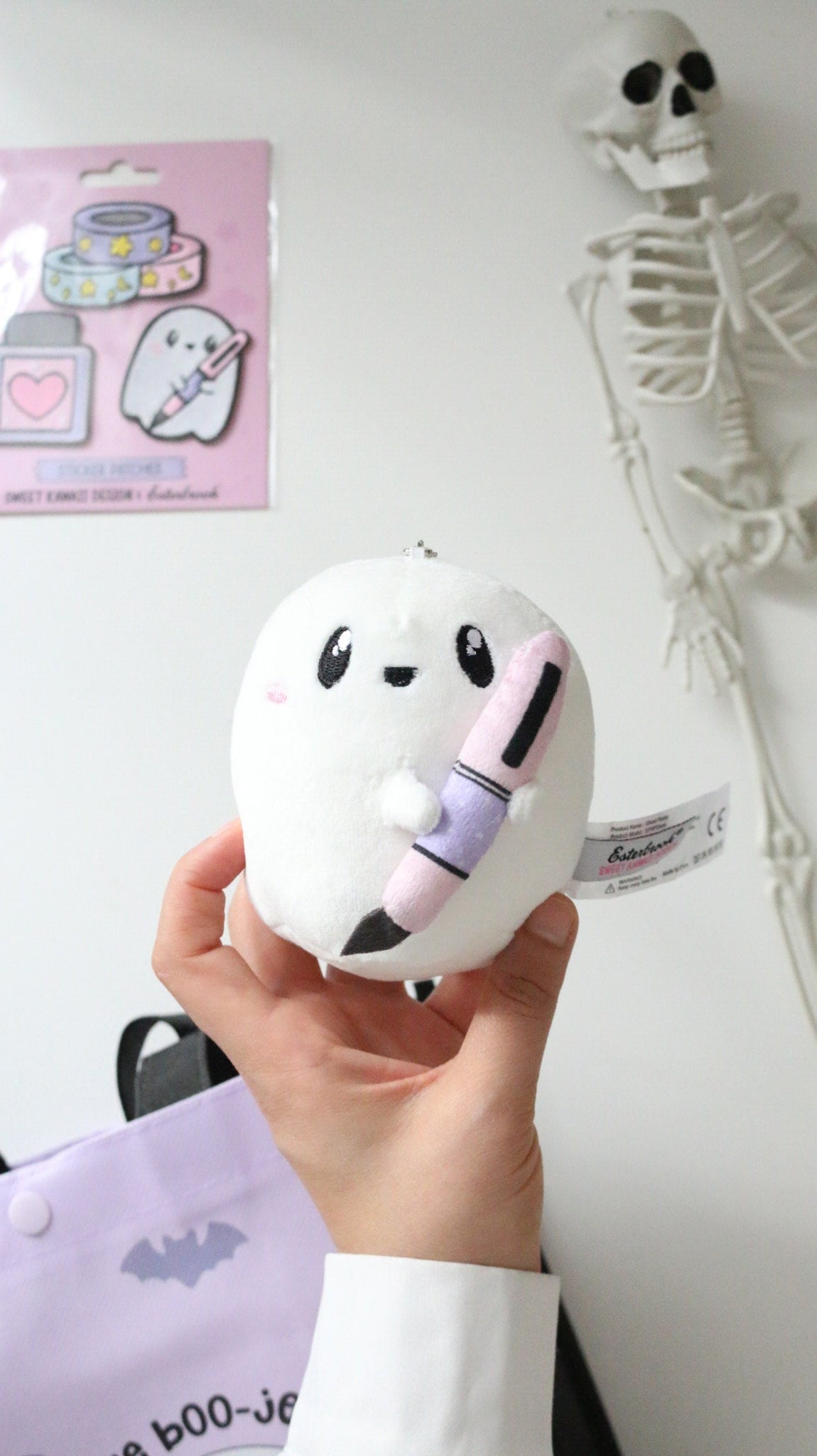 Boo-Anne ghost plush in hand
